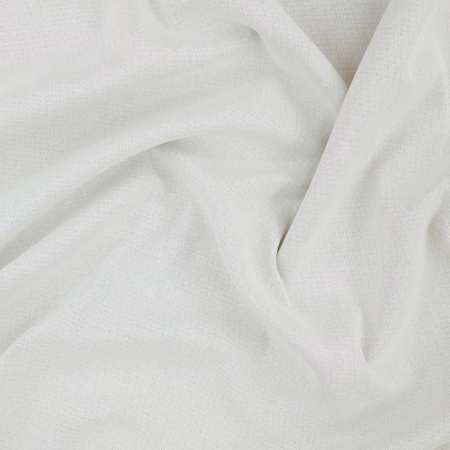 Near-white ecru fabric with a fine woven texture falling into soft folds