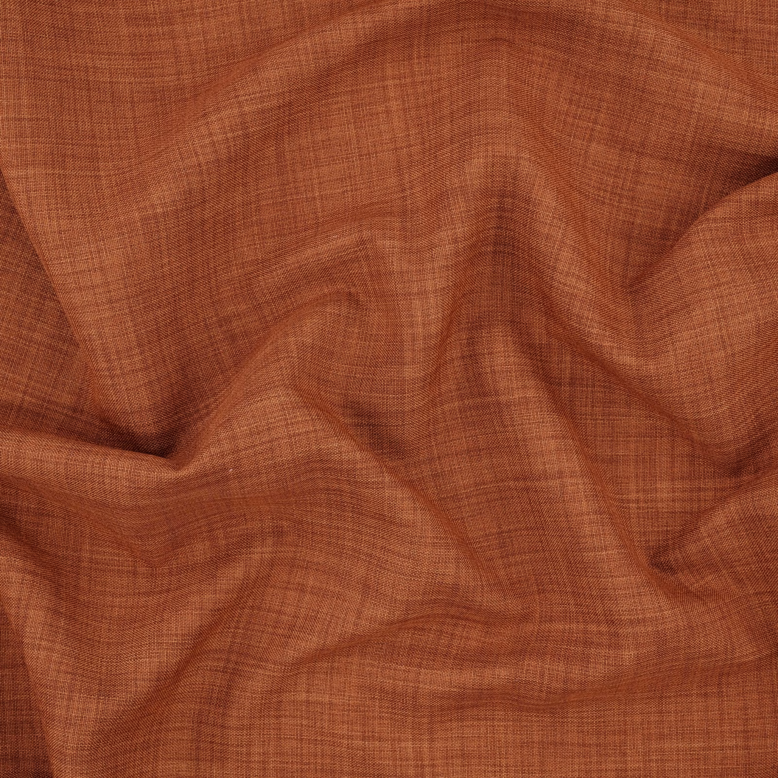 Paprika terracotta fabric with a fine crosshatch weave shown in soft folds