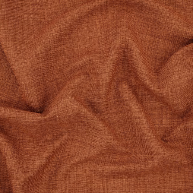 Paprika terracotta fabric with a fine crosshatch weave shown in soft folds