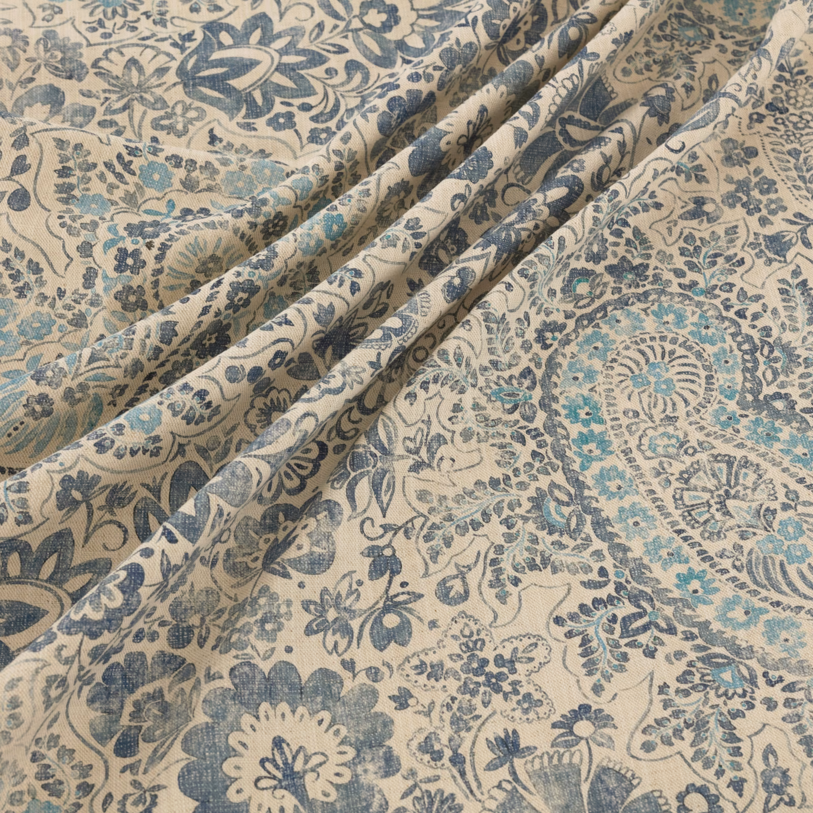 Cream Southold textile with blue-grey florals, teal accents and softly textured woven surface