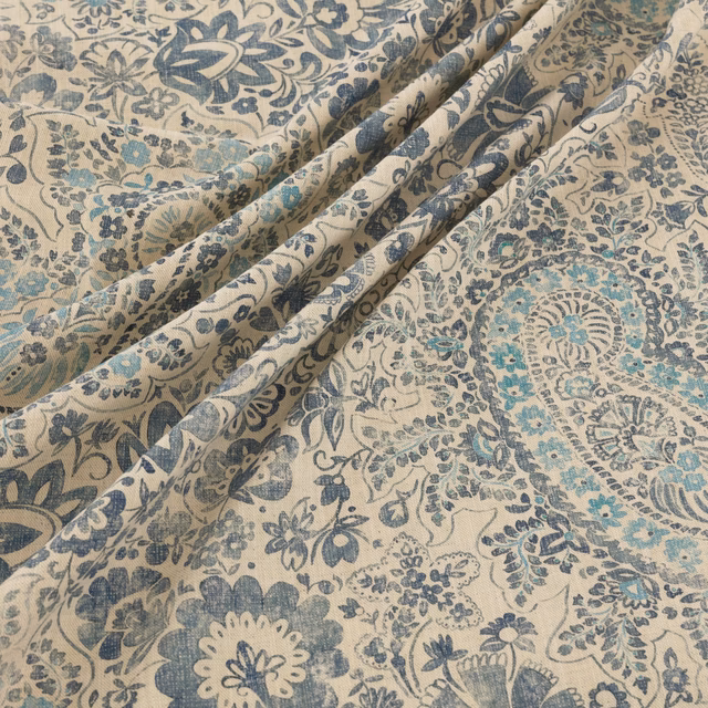 Cream Southold textile with blue-grey florals, teal accents and softly textured woven surface