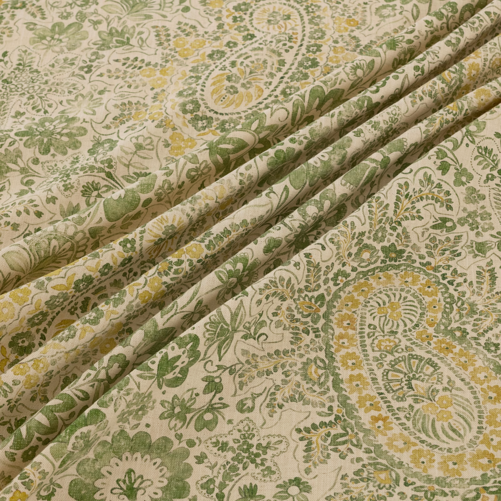 Cream textile with sage paisleys, olive foliage, and muted mustard florals
