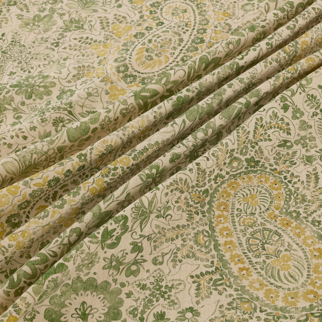 Cream textile with sage paisleys, olive foliage, and muted mustard florals