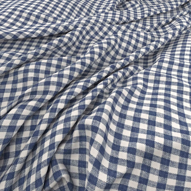 Muted Delft blue and ivory gingham fabric gathered into softly textured folds
