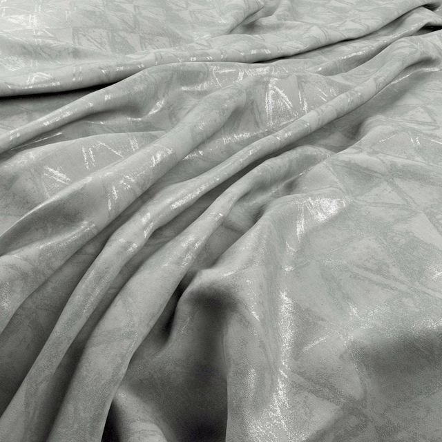 Pale silver-grey fabric with an abstract tonal pattern and glossy highlights in fluid folds