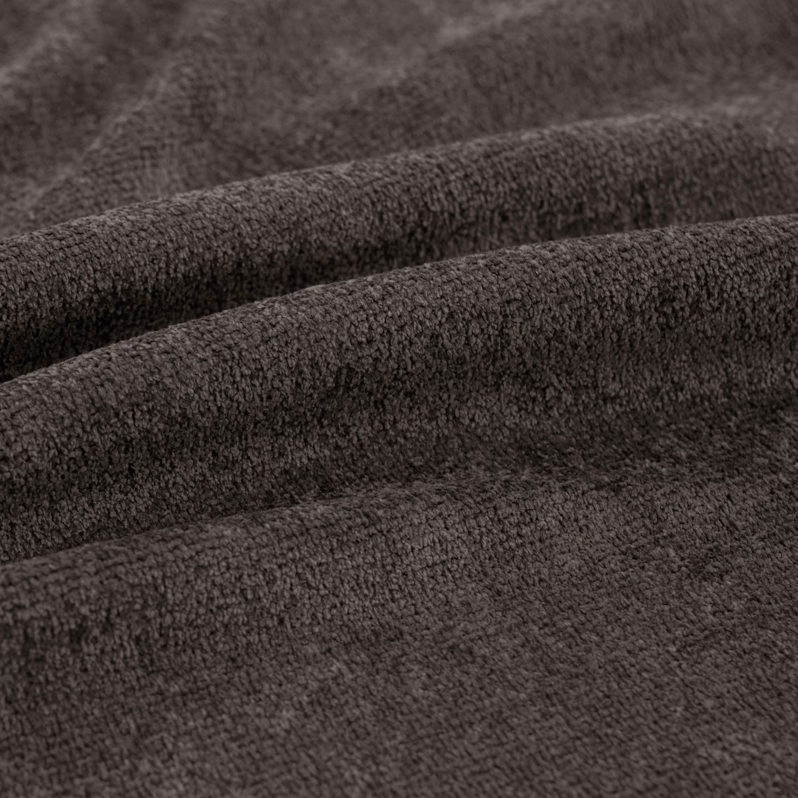 Close-up of deep charcoal textile with dense, softly pebbled plush texture