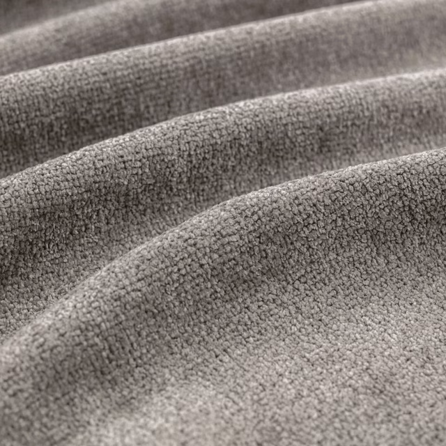 Close-up of dove-grey nubby fabric draped in softly rounded folds