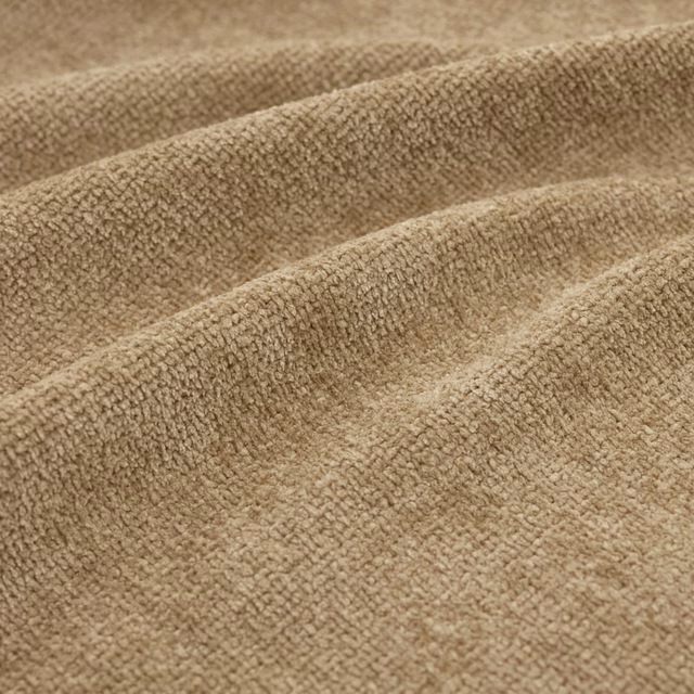 Close-up of Suave Dune’s warm dune-toned, raised nubby woven texture