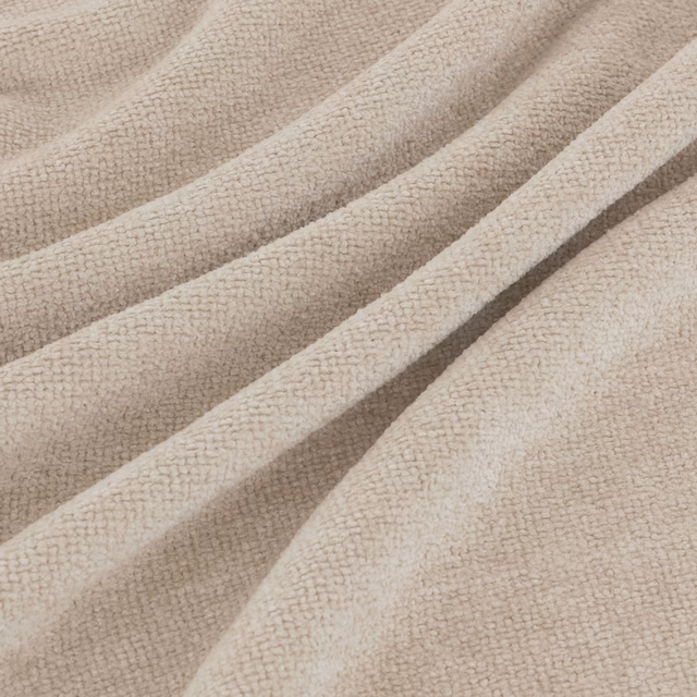 Warm feather beige fabric with fine nubby weave in broad sculptural folds