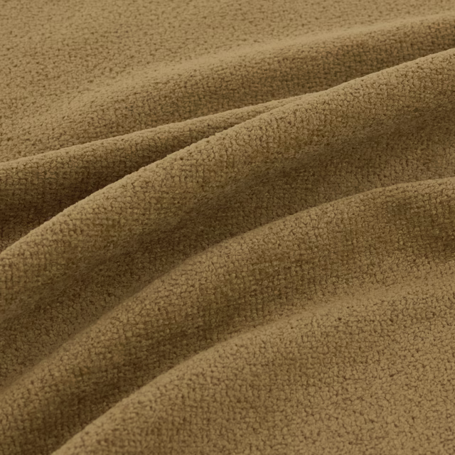 Close-up of warm fennel-olive plush fabric with fine looped texture and folded ridges