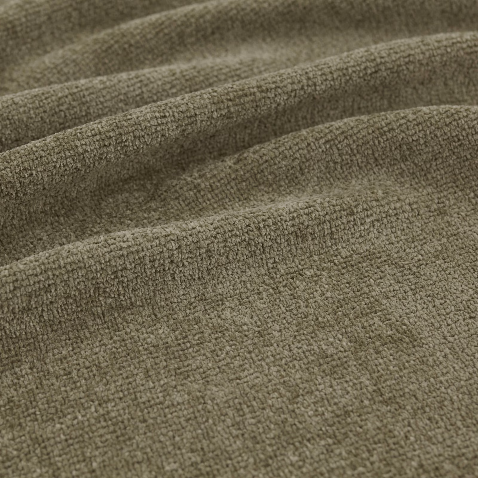 Muted forest olive fabric with a dense nubby weave and soft folded texture