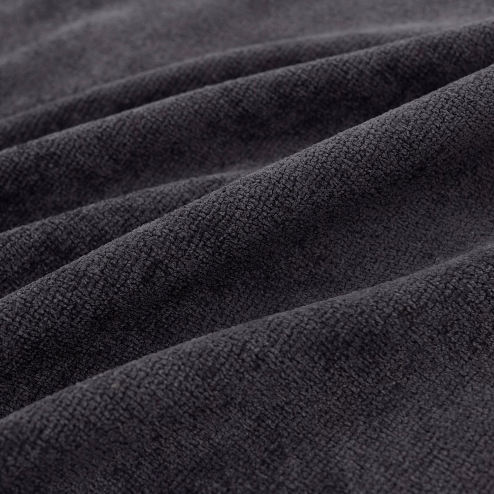 Folded close-textured Suave fabric in deep ink blue with charcoal-black shading