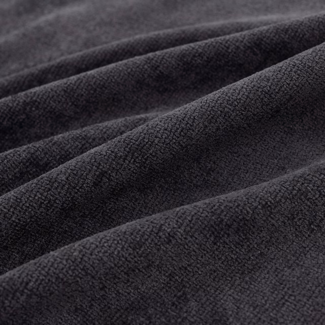 Folded close-textured Suave fabric in deep ink blue with charcoal-black shading