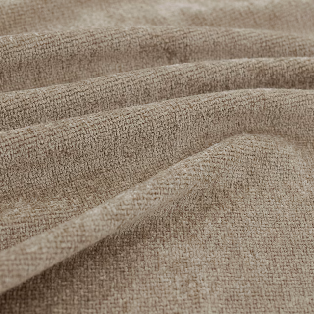 Warm taupe fabric with irregular nubby weave arranged in soft, shaded folds