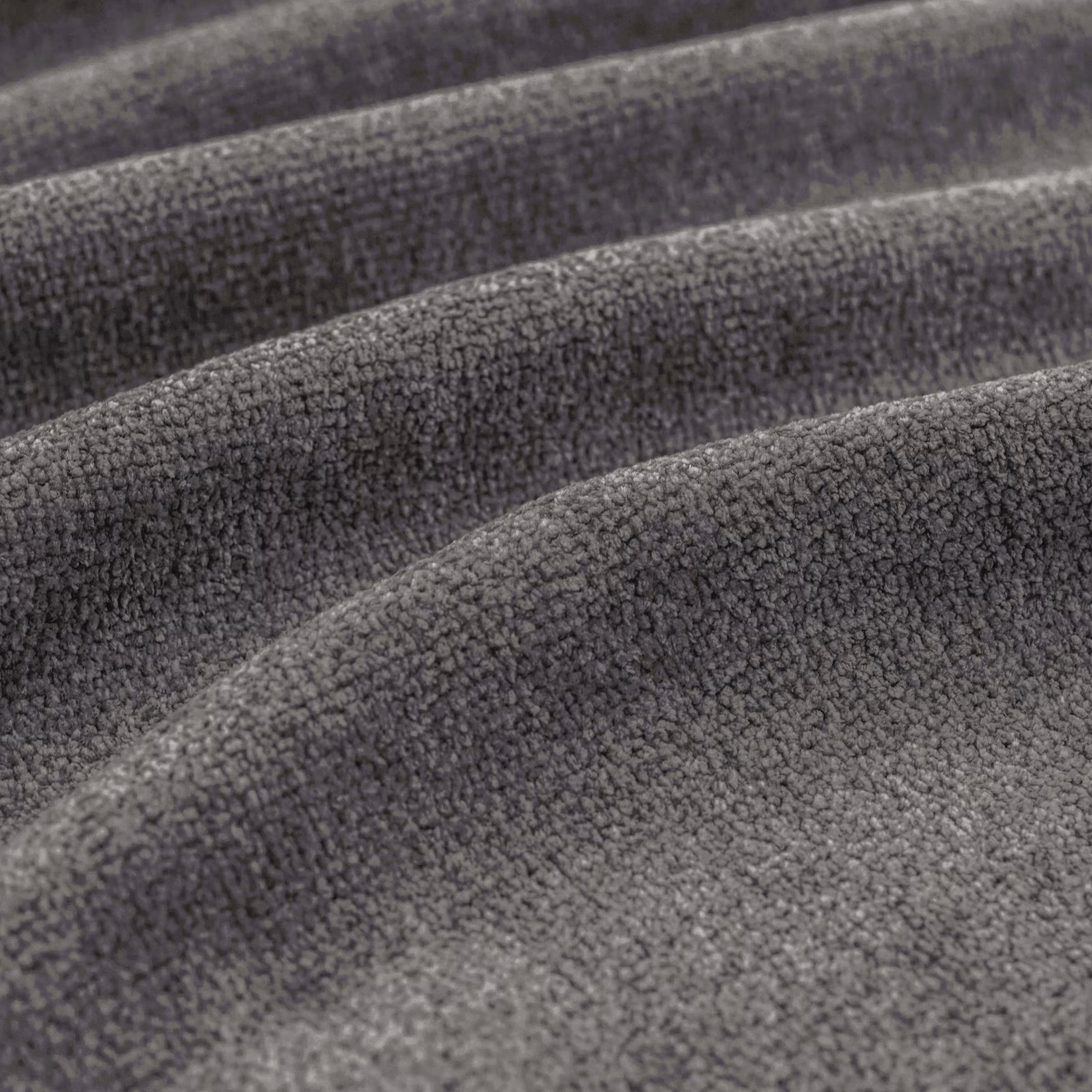 Close-up of cool charcoal-grey fabric showing dense nubby pile and sculpted folds