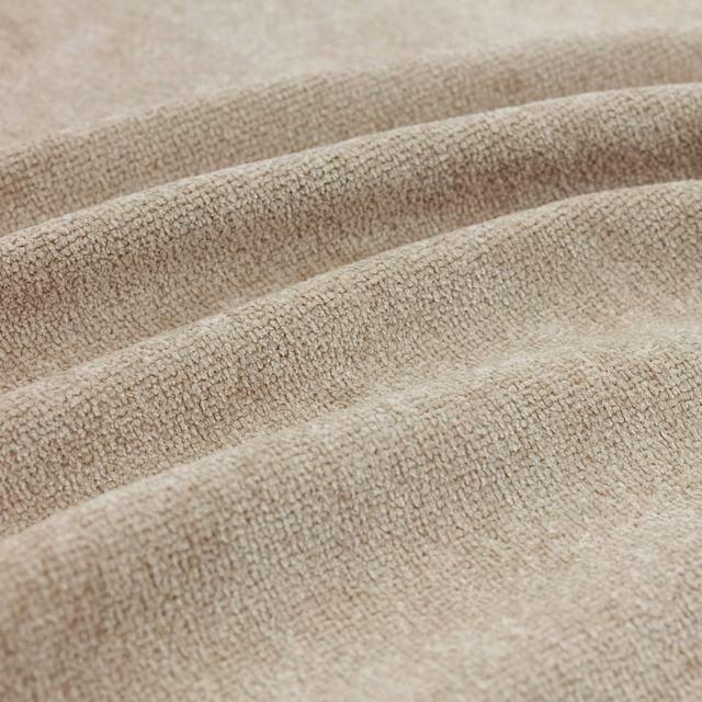 Warm stone taupe fabric with a close, softly nubby woven texture in folds
