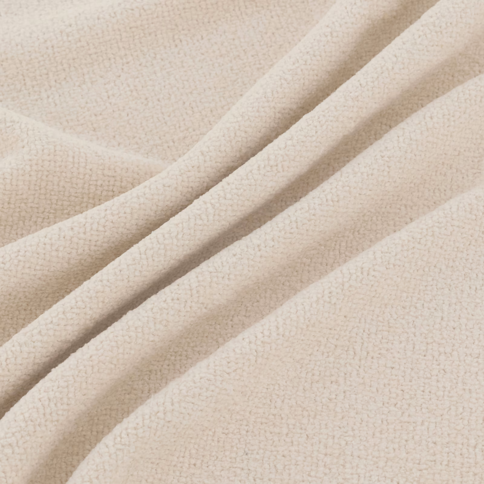 Warm vanilla cream fabric with fine pebbled texture arranged in soft flowing folds