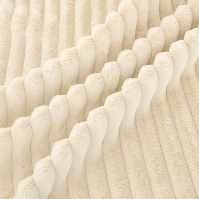 Ivory cream fabric with plush raised ridges and sculptural diagonal channels