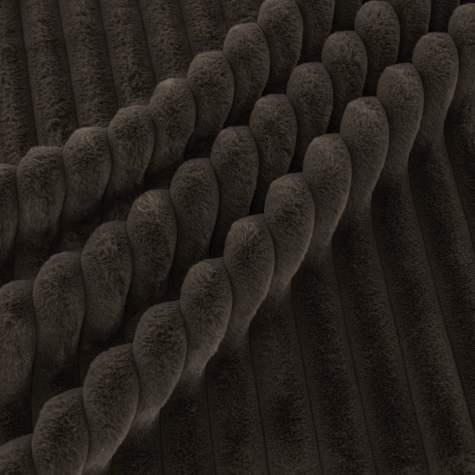 Deep sable-brown textile with plush diagonal cords over a dark ribbed ground