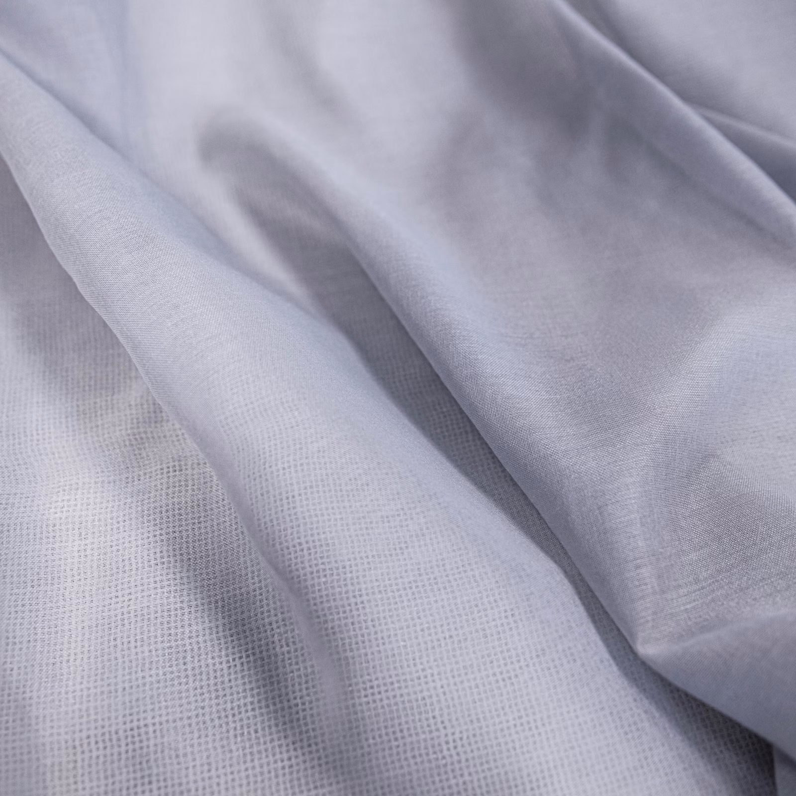 Cool lilac-grey Symi textile with soft folds and a fine open weave