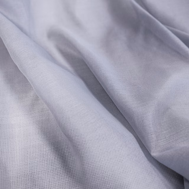 Cool lilac-grey Symi textile with soft folds and a fine open weave