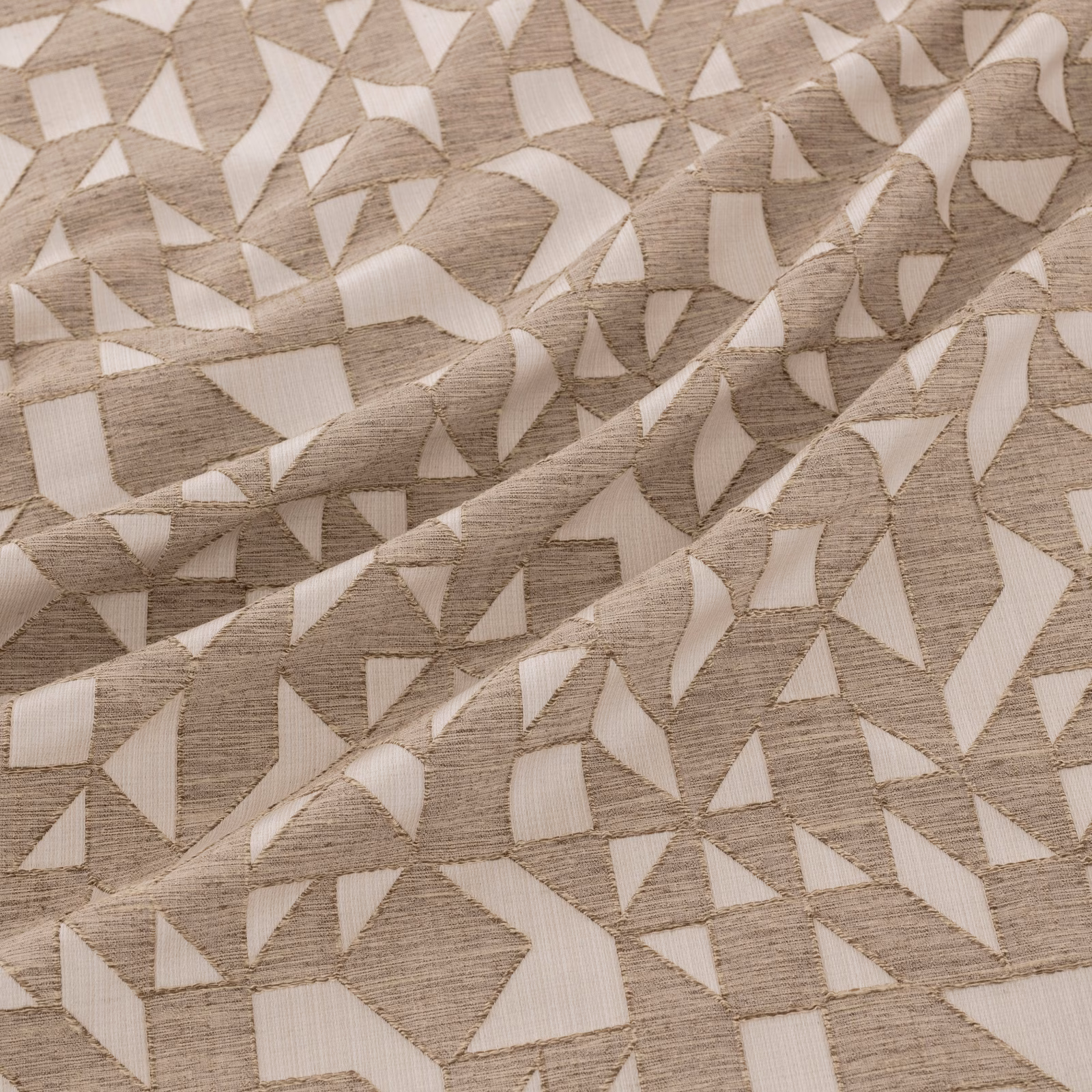 Warm bronze-taupe woven ground with ivory angular shards and raised texture