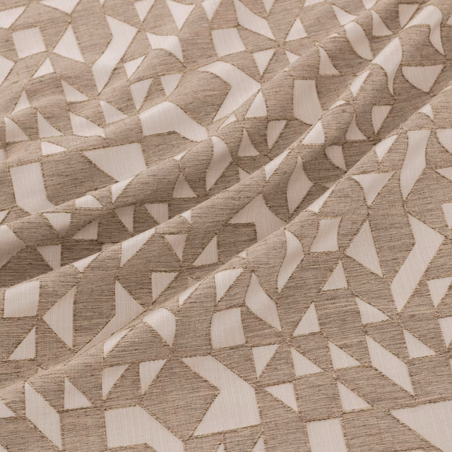 Warm bronze-taupe woven ground with ivory angular shards and raised texture