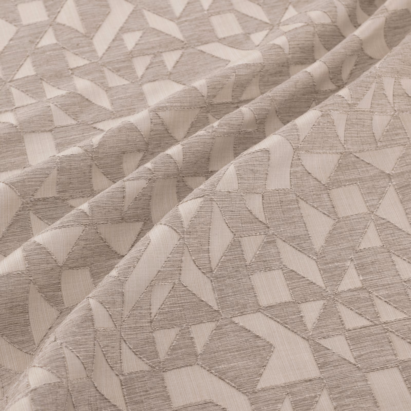 Warm silver-grey woven fabric with irregular geometric fragments and tactile linear texture
