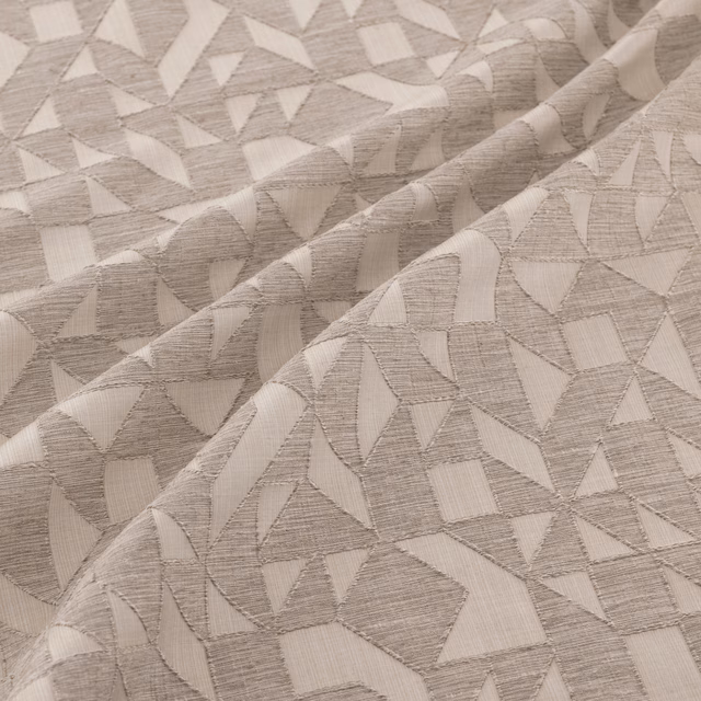 Warm silver-grey woven fabric with irregular geometric fragments and tactile linear texture