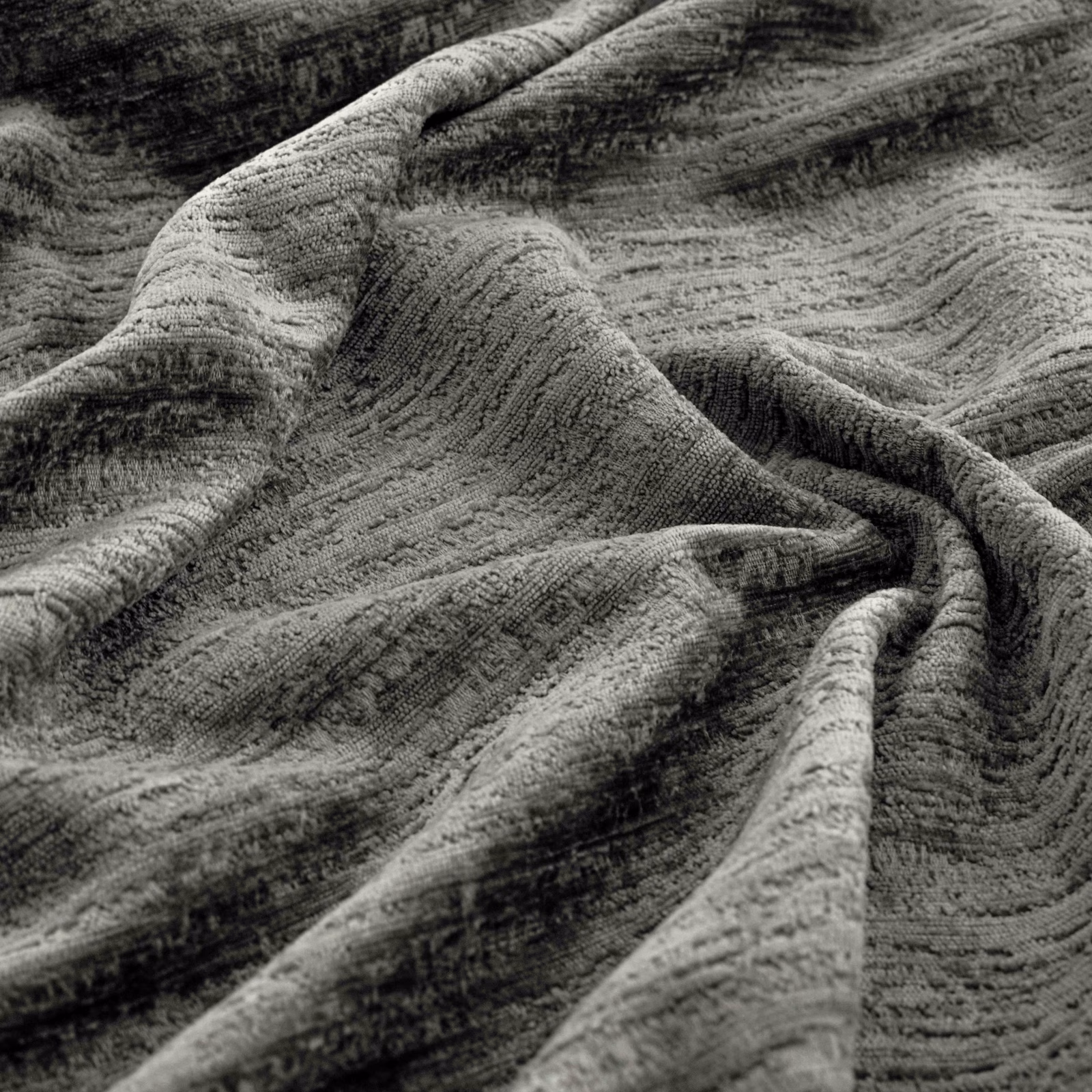Cool Arctic grey textile with raised charcoal striations and a softly rippled surface