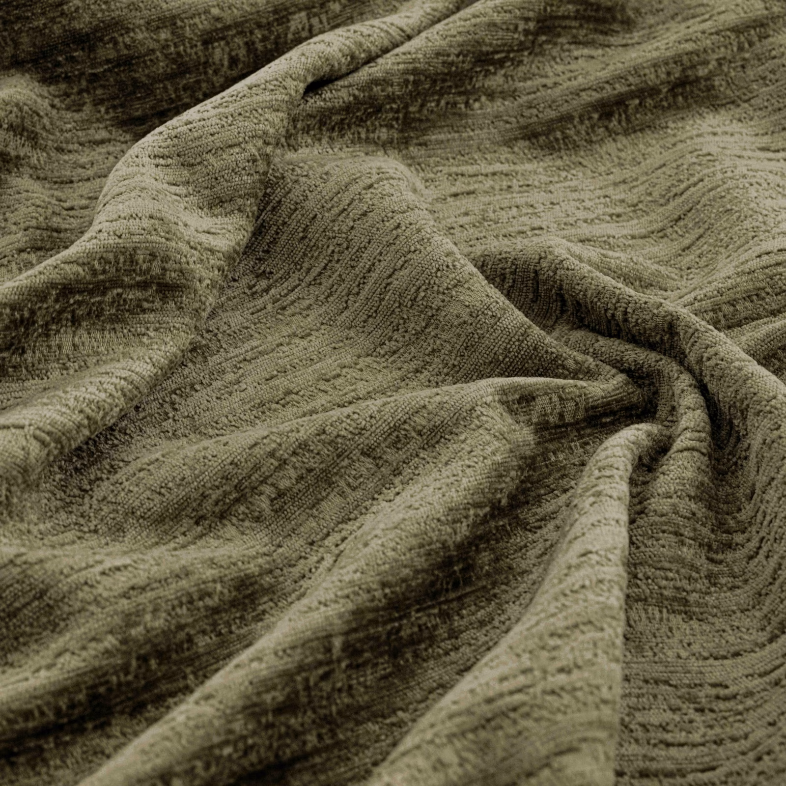 Deep olive fabric with irregular raised ridges and shadowed gathered folds