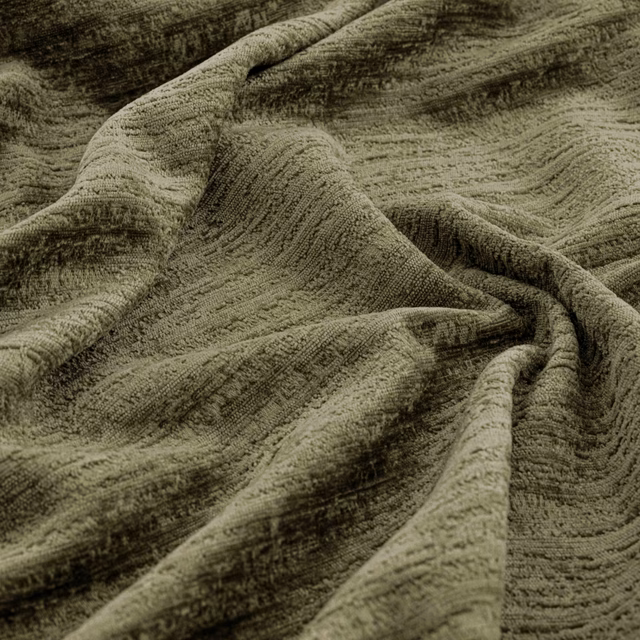 Deep olive fabric with irregular raised ridges and shadowed gathered folds