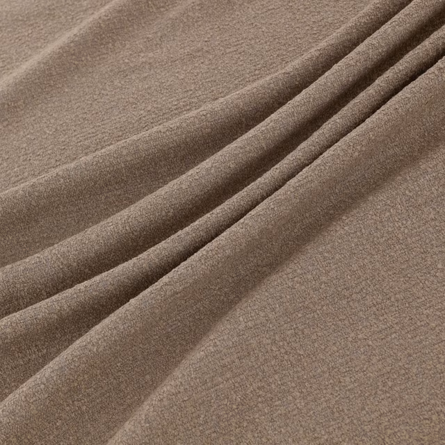 Warm mushroom-taupe fabric with a softly brushed velvety texture draped in broad folds