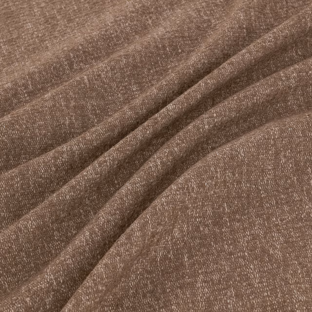 Warm fig-taupe woven fabric showing a finely nubby, softly mottled surface in folds