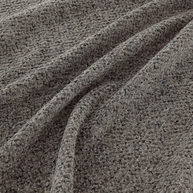 Close-up of mottled granite-grey fabric with chunky nubby woven texture and folded ridges