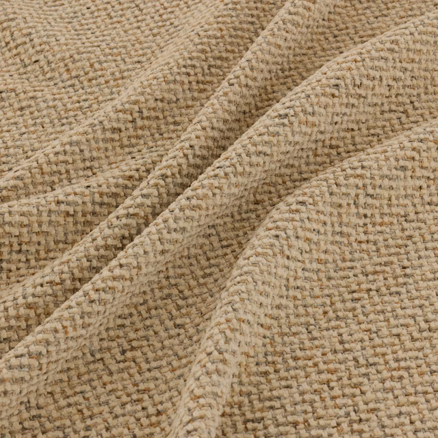 Close-up of warm wheat beige woven fabric with cream, tan and brown flecks