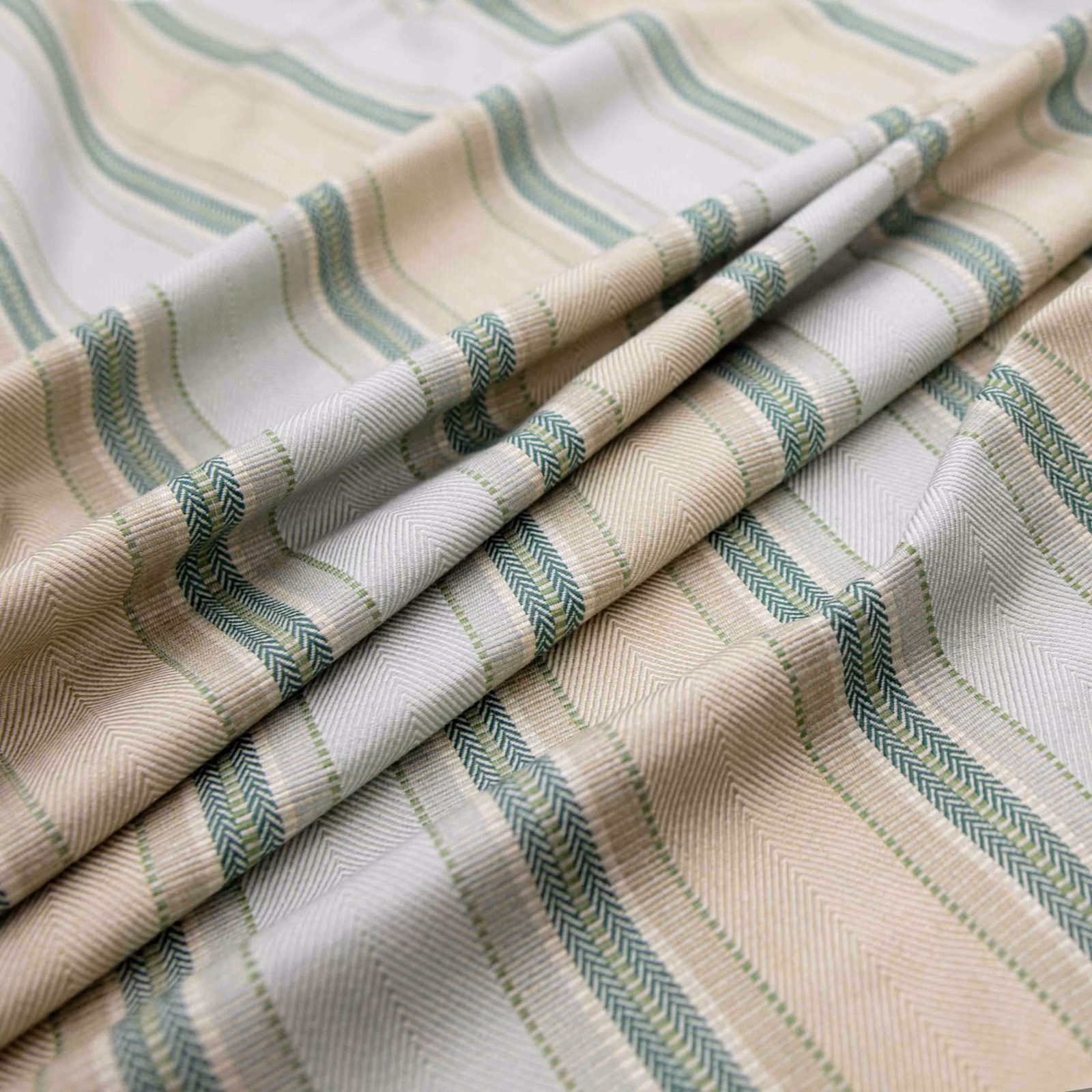 Cream and beige ribbed textile with muted celadon green woven stripes