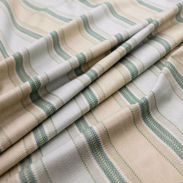 Cream and beige ribbed textile with muted celadon green woven stripes