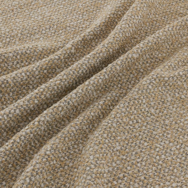 Warm alpaca-beige boucle weave with cream and taupe flecks in gathered folds