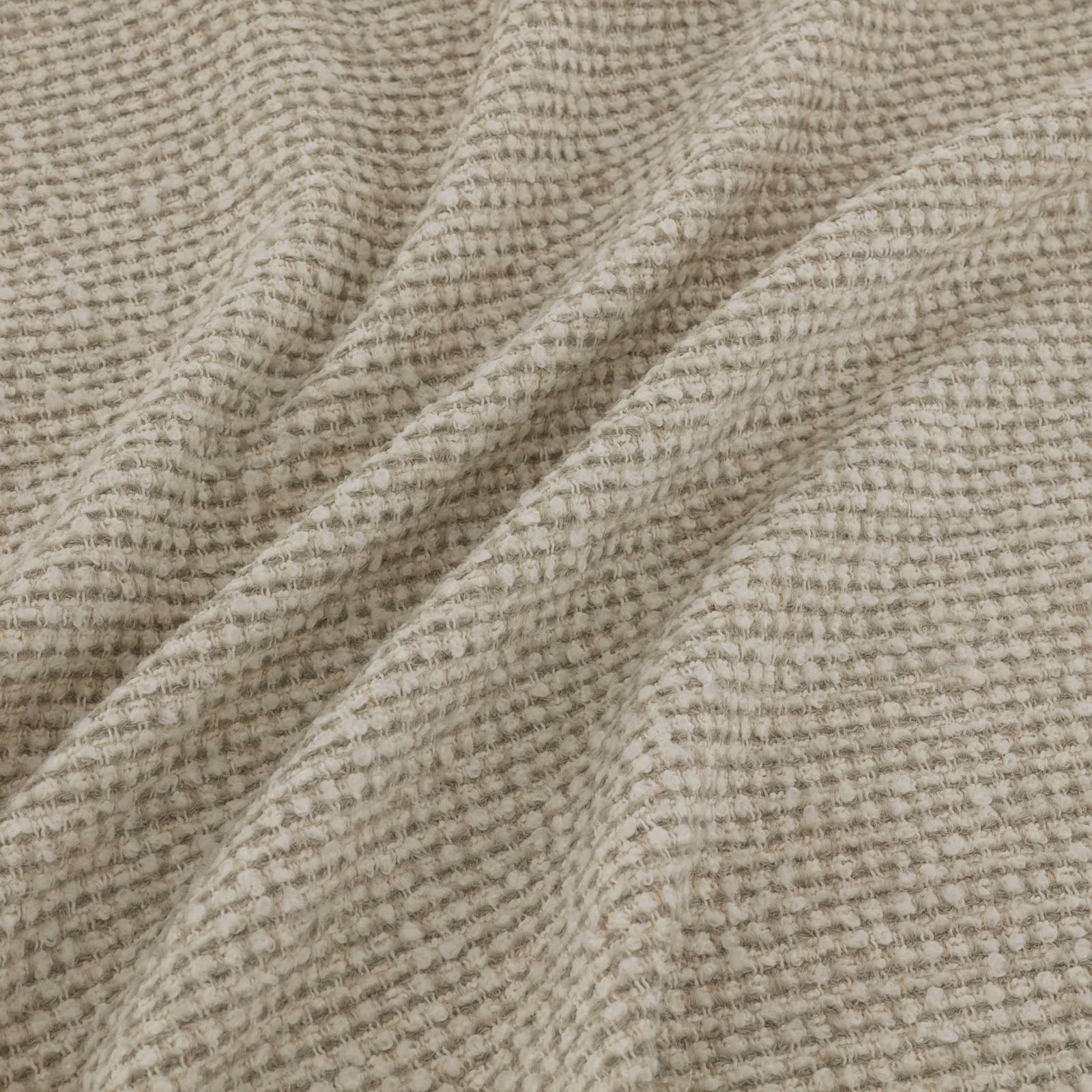 Warm greige taupe fabric with raised nubby tufted weave and soft tonal ridges