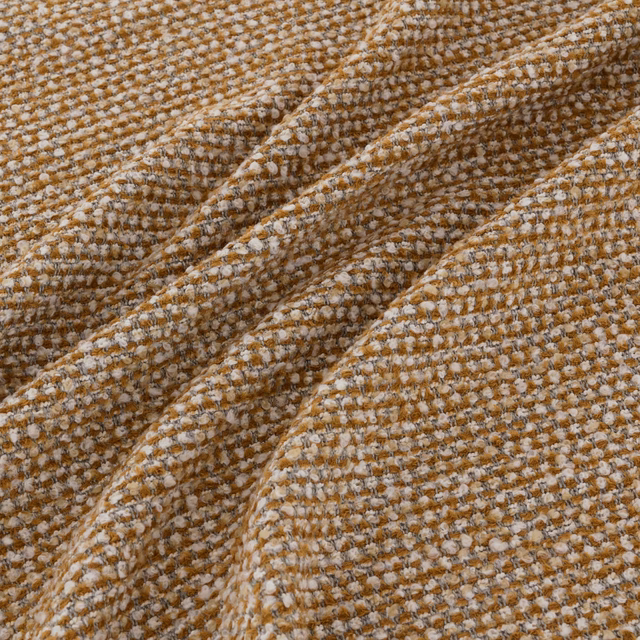 Warm camel-brown woven swatch with cream flecks and raised nubby texture