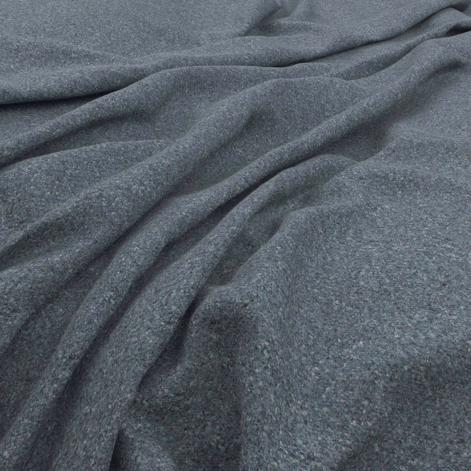Close-up of cool slate blue-grey tweed with fine flecks and soft folded texture
