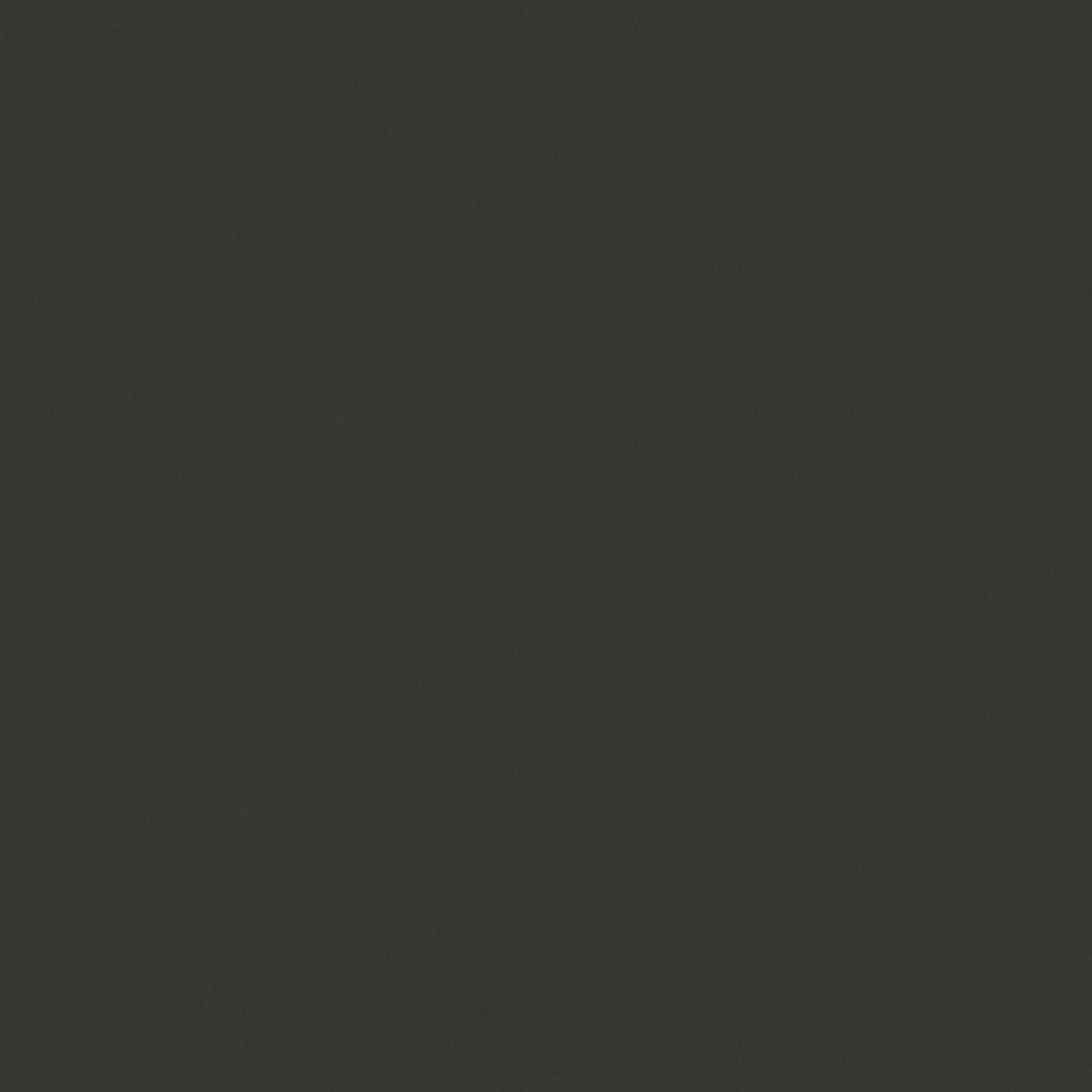Close-up of dense anthracite textile with subtle charcoal surface texture