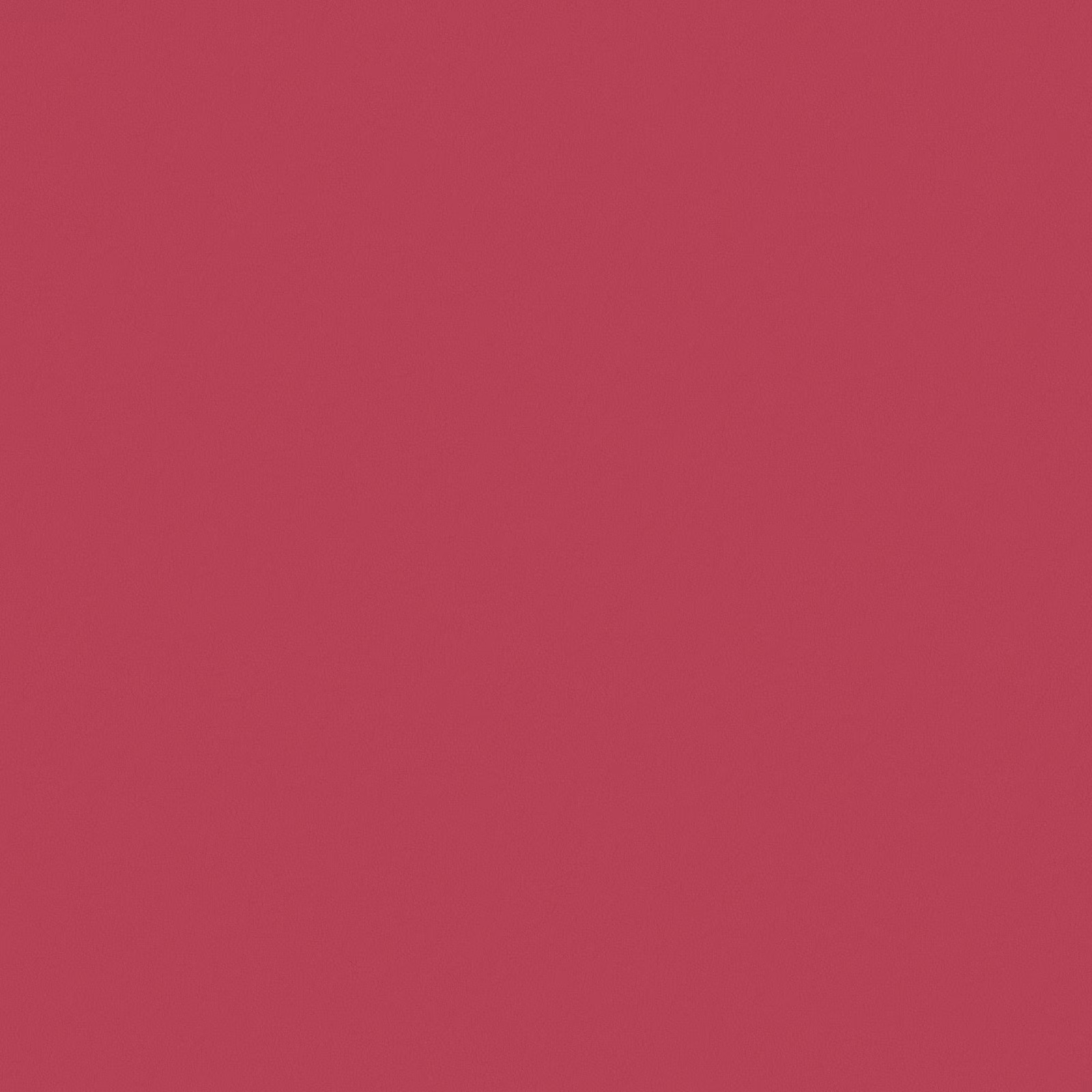 Saturated raspberry-red plain fabric with a subtly textured, matte surface