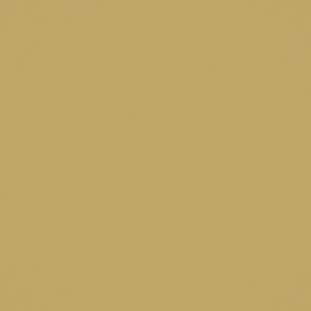 Close-up of plain muted quince-gold fabric with a fine, softly textured surface