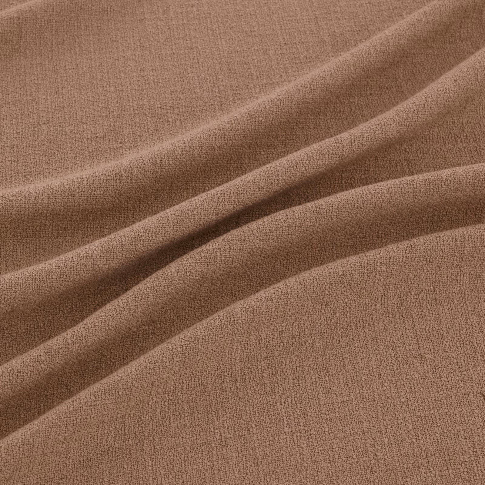 Warm clay-taupe woven fabric with a fine pebbled texture in soft diagonal folds