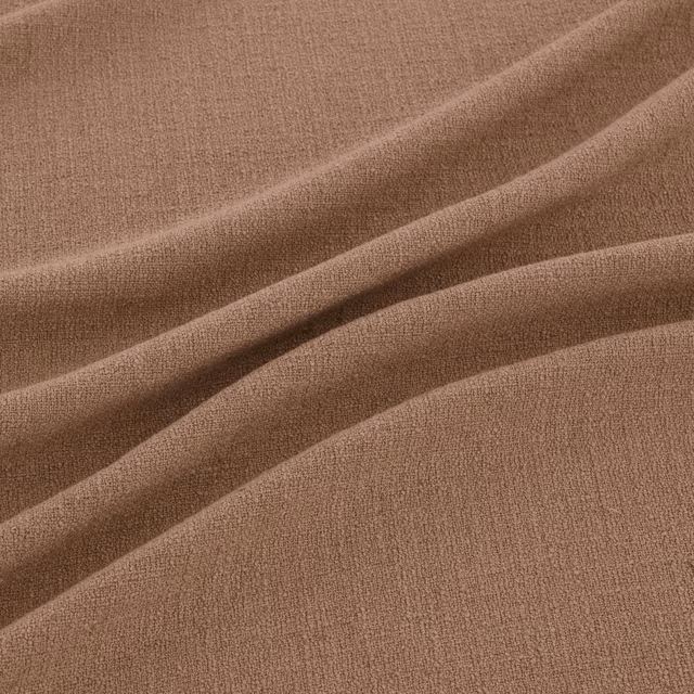 Warm clay-taupe woven fabric with a fine pebbled texture in soft diagonal folds