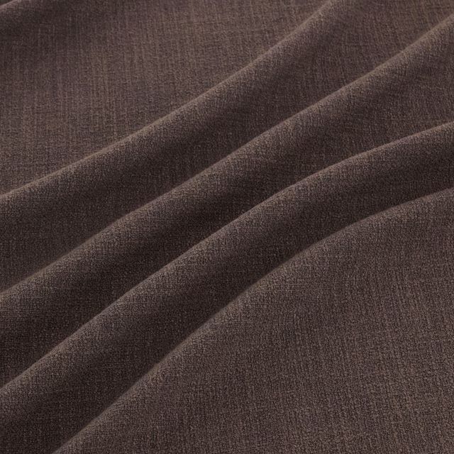 Deep cocoa-brown woven fabric with subtle grain in broad diagonal folds