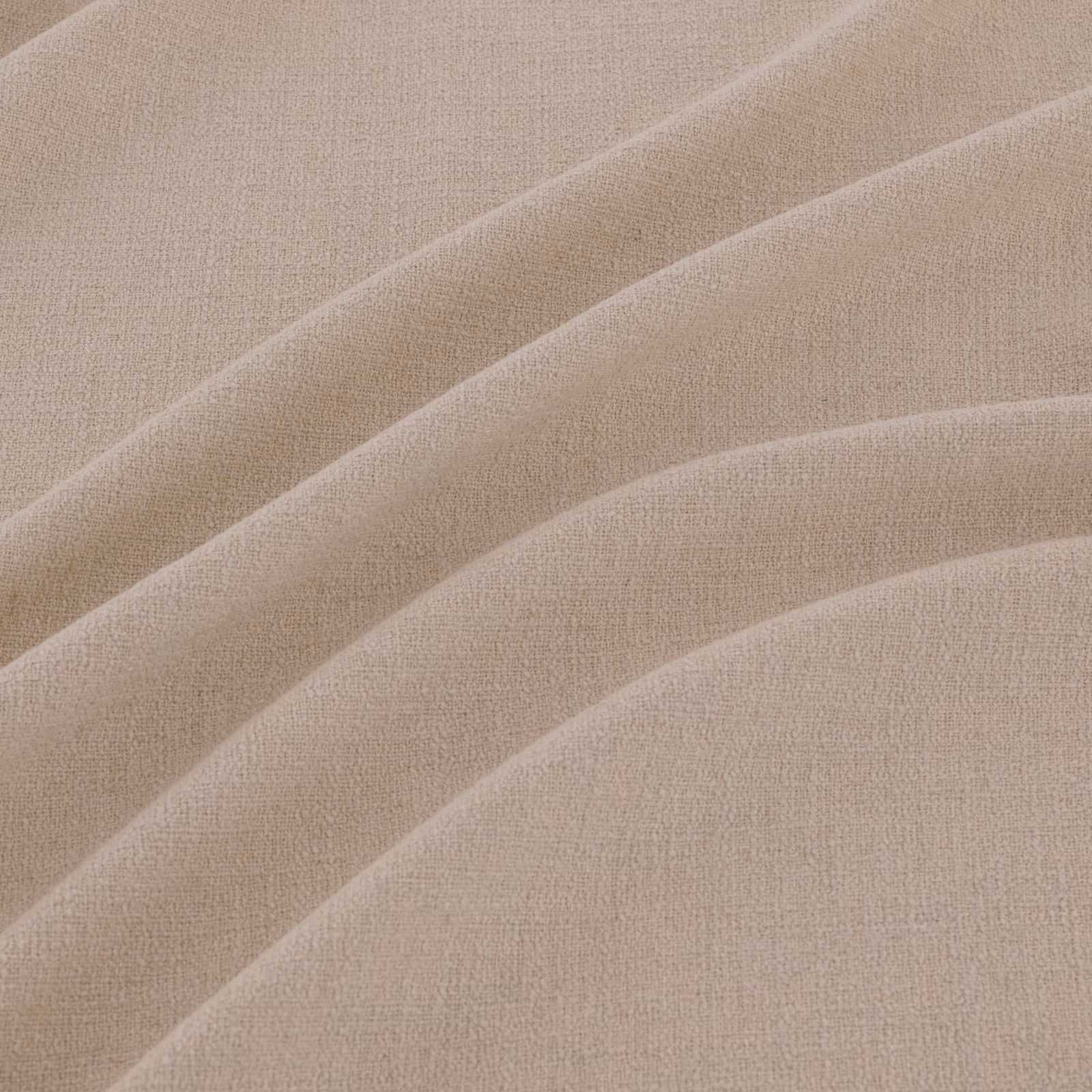 Close-up of pale greige-beige plain weave with softly shadowed flowing folds