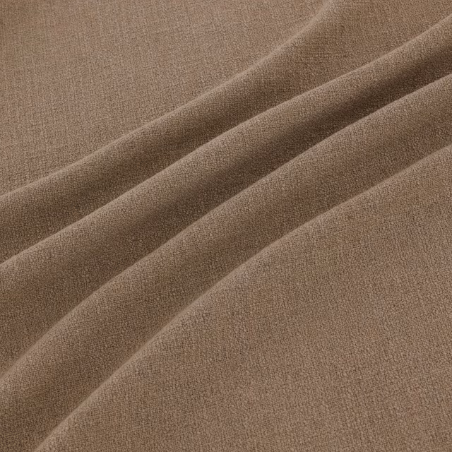 Warm maize-taupe woven fabric with fine grain and broad diagonal folds